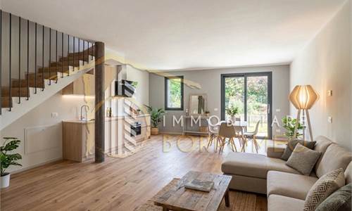 Porzione di villa bifamiliare in classe A+ con giardino e box doppio